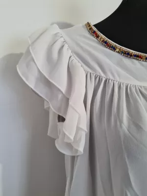 Blouse with a frill on the sleeves and decorative ecru sequins - Blouses