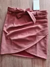 Short pink suede skirt